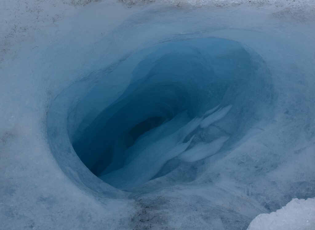 View into a crevasse in the ice on a glacier