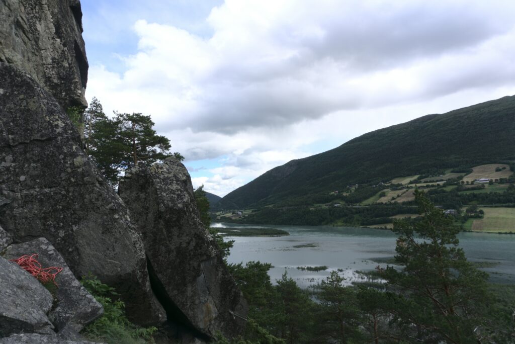 View from the climbing spot at Lom in Norway, over a lake and hills